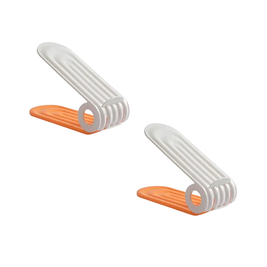 adjustable shoe storage organizer holding a pair of flats
plastic shoe rack slots shown with shoes on a wooden floor
double layer shoe storage rack for saving closet space
white and orange shoe organizer displayed beside shoes
shoe storage organizer with adjustable height design