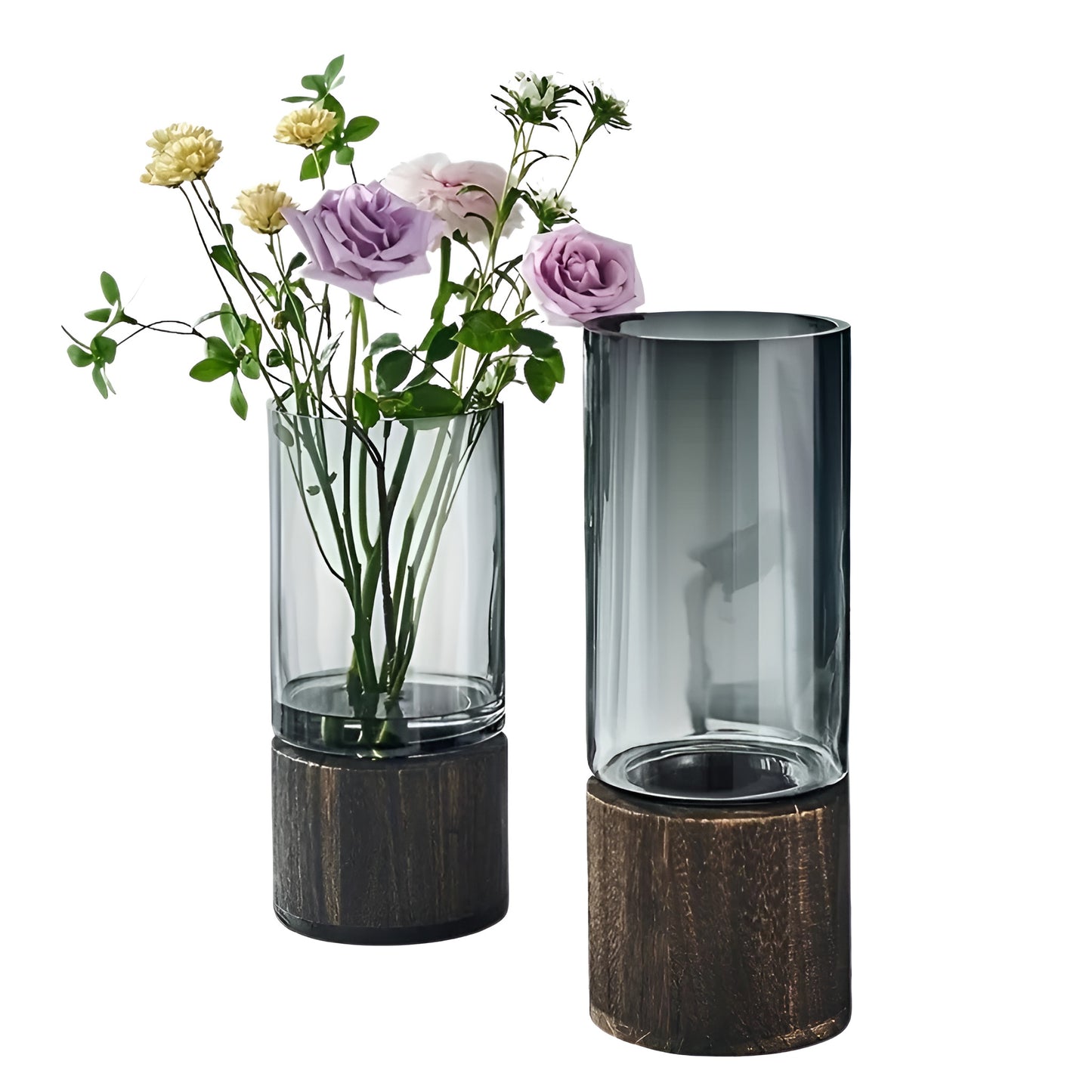 glass bud vase placed on table with books and flowers arrangement.
