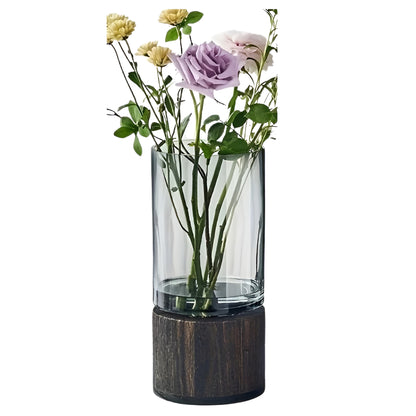 modern flower vase with transparent glass and natural wood stand
