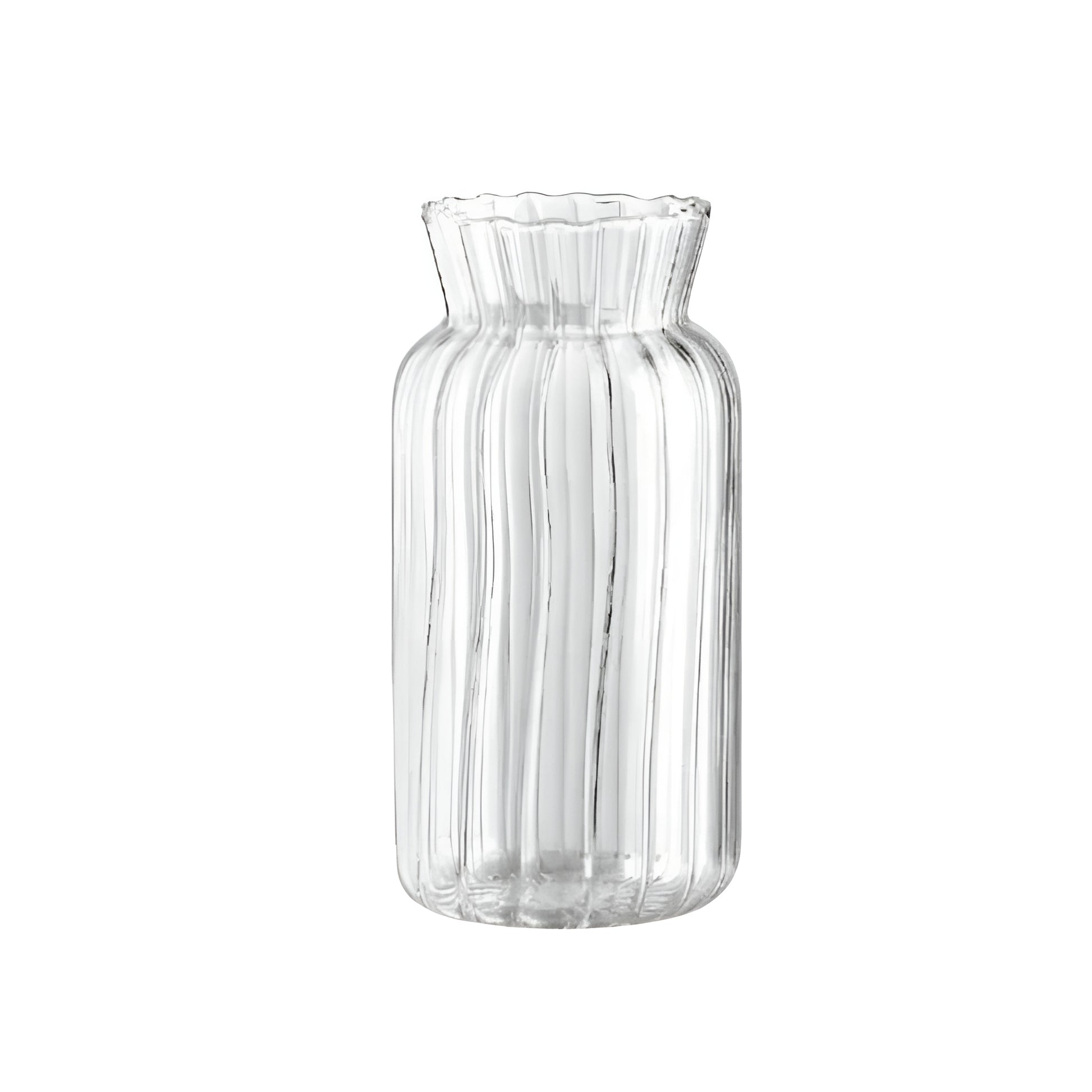 ribbed glass flower vase with water and single rose stem