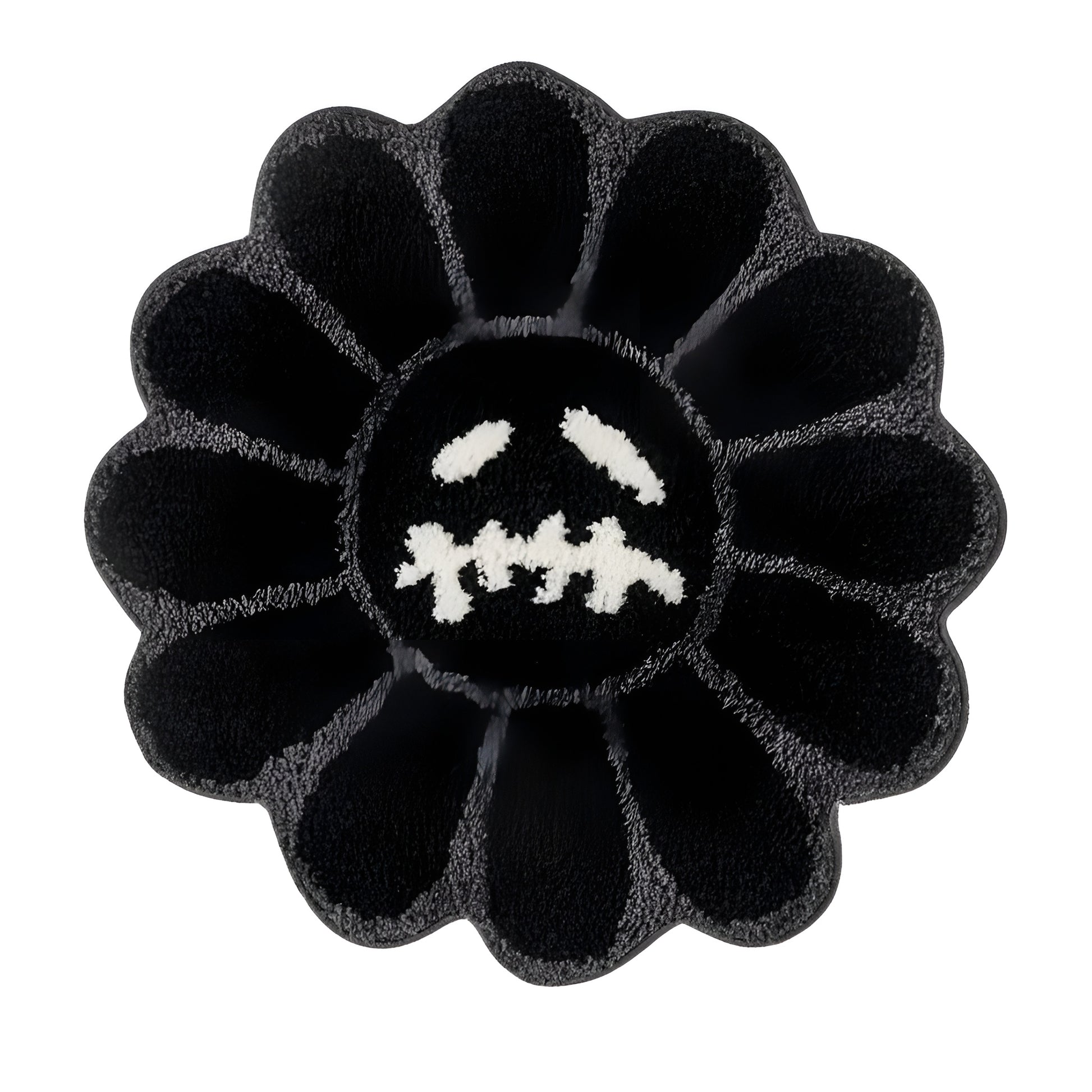 Black flower shaped tufted rug on a living room floor
