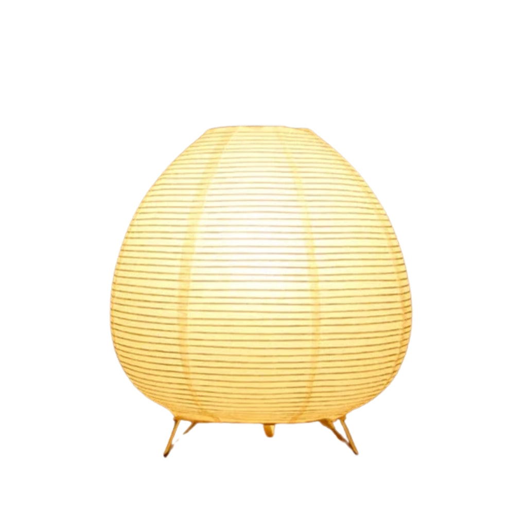 rice paper table lamps glowing warm light on wooden surface.
Japanese style table lamp with white lantern shade and warm LED glow.