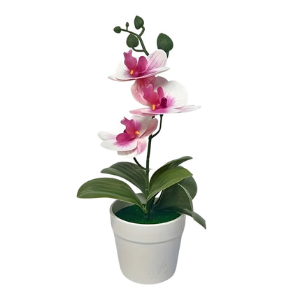 artificial plant orchid with pink and white flowers in a white pot
faux orchid tabletop decor with green leaves and striped petals
artificial orchid flowers arrangement in white planter for indoor decor
potted artificial plant with orchid blooms for home or office display