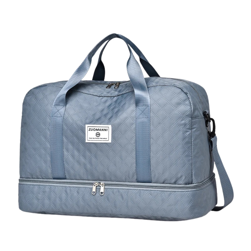 woman carrying pink travel duffel bag beside a suitcase
quilted travel duffel bags in pink and cream colors
lightweight nylon duffel bag placed on blue luggage
large soft travel bag with zipper closure and shoulder strap
weekender duffel bag shown in a travel setting