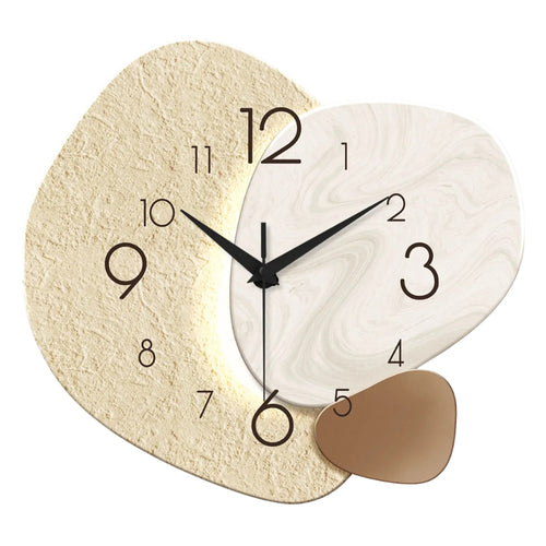 large wall clock with abstract geometric design on living room wall
