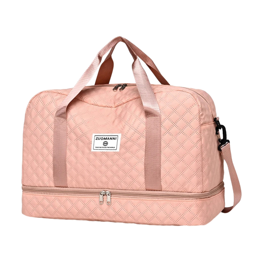 woman carrying pink travel duffel bag beside a suitcase
quilted travel duffel bags in pink and cream colors
lightweight nylon duffel bag placed on blue luggage
large soft travel bag with zipper closure and shoulder strap
weekender duffel bag shown in a travel setting