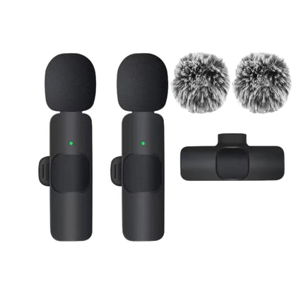 wireless microphone connected to a smartphone with USB C receiver
small lavalier microphone held beside a phone for recording
plug and play wireless microphone set with transmitter and receiver
portable microphones for phone video recording and live streaming
wireless lavalier mic shown with smartphone connection steps