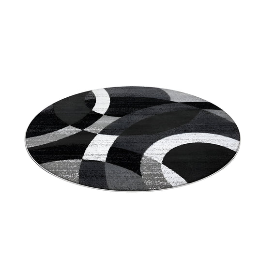 Round black and gray geometric area rug in a modern living room
Large washable rug with abstract pattern under living room seating area
Modern round area rugs shown on a light floor in a home interior
Black white and gray geometric rugs displayed in a spacious room
Soft round living room rug with modern curved pattern design