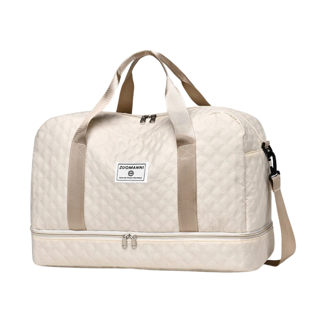 woman carrying pink travel duffel bag beside a suitcase
quilted travel duffel bags in pink and cream colors
lightweight nylon duffel bag placed on blue luggage
large soft travel bag with zipper closure and shoulder strap
weekender duffel bag shown in a travel setting