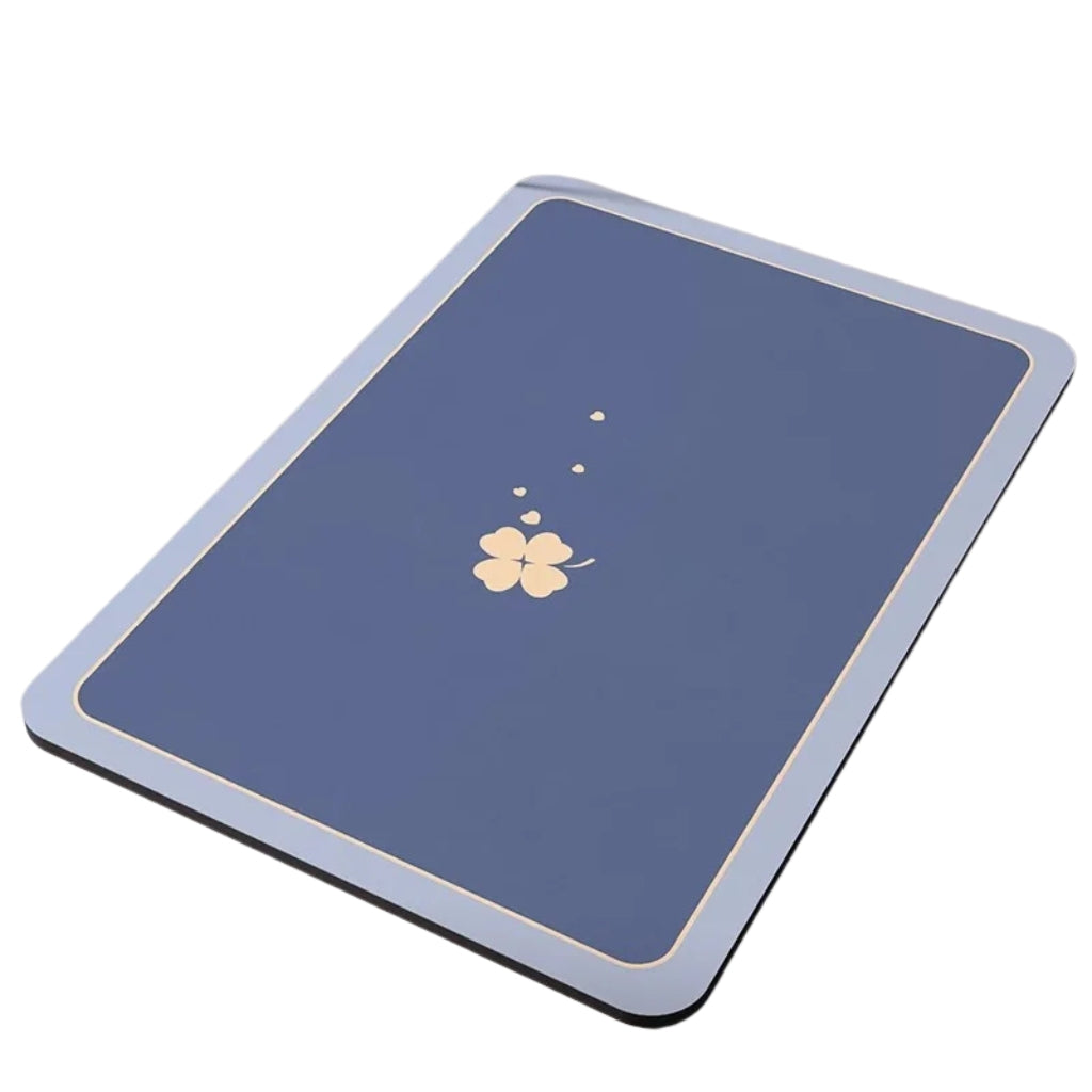 blue bathroom mat placed on a bathroom floor near a shower