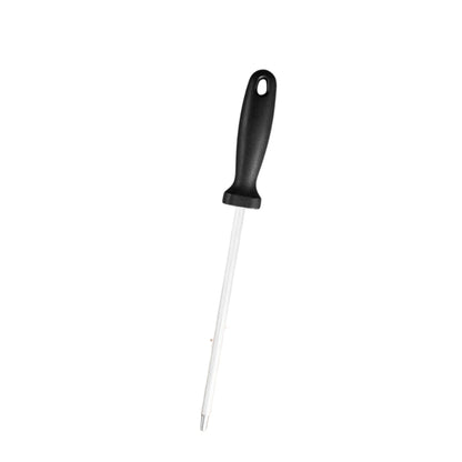 Hand forged kitchen knife with wooden handle on a white kitchen counter