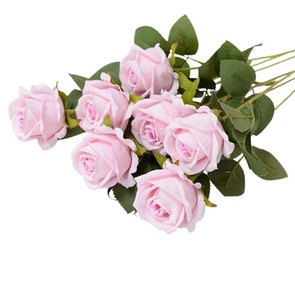 silk flowers red rose stems arranged in a bouquet indoors