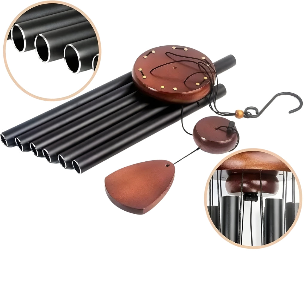 Black metal wind chimes with wooden components on a white background