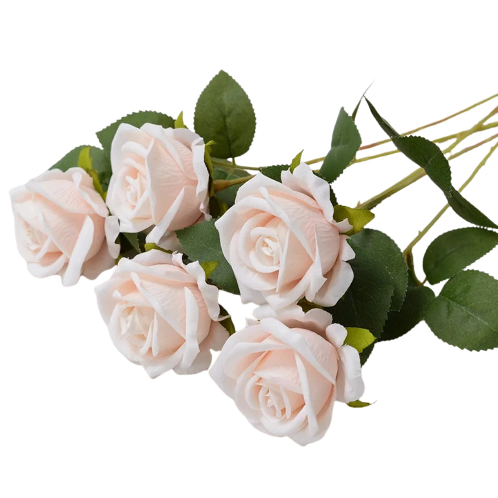 silk flowers red rose stems arranged in a bouquet indoors
