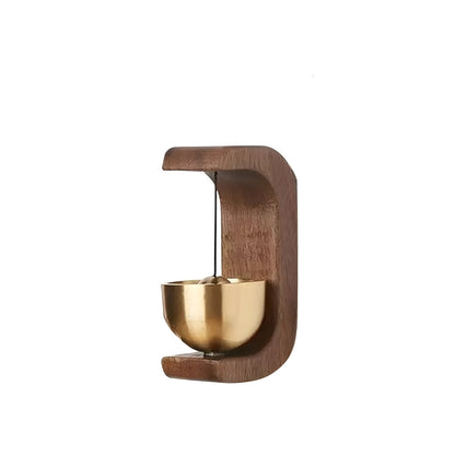 Wooden holder with a gold bowl on a white background