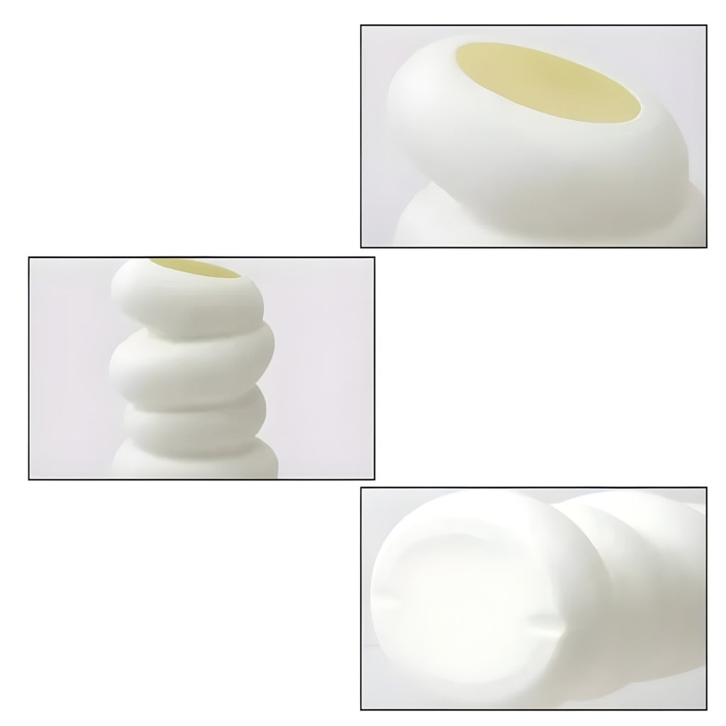 white flower vase with spiral stacked shape and angled opening
modern white bud vase for shelf or tabletop decor
spiral flower vase in white resin style for home decoration
small white vase with curved layered design on a plain background