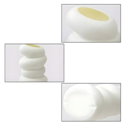 white flower vase with spiral stacked shape and angled opening
modern white bud vase for shelf or tabletop decor
spiral flower vase in white resin style for home decoration
small white vase with curved layered design on a plain background