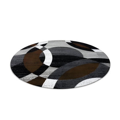 Round black and gray geometric area rug in a modern living room
Large washable rug with abstract pattern under living room seating area
Modern round area rugs shown on a light floor in a home interior
Black white and gray geometric rugs displayed in a spacious room
Soft round living room rug with modern curved pattern design