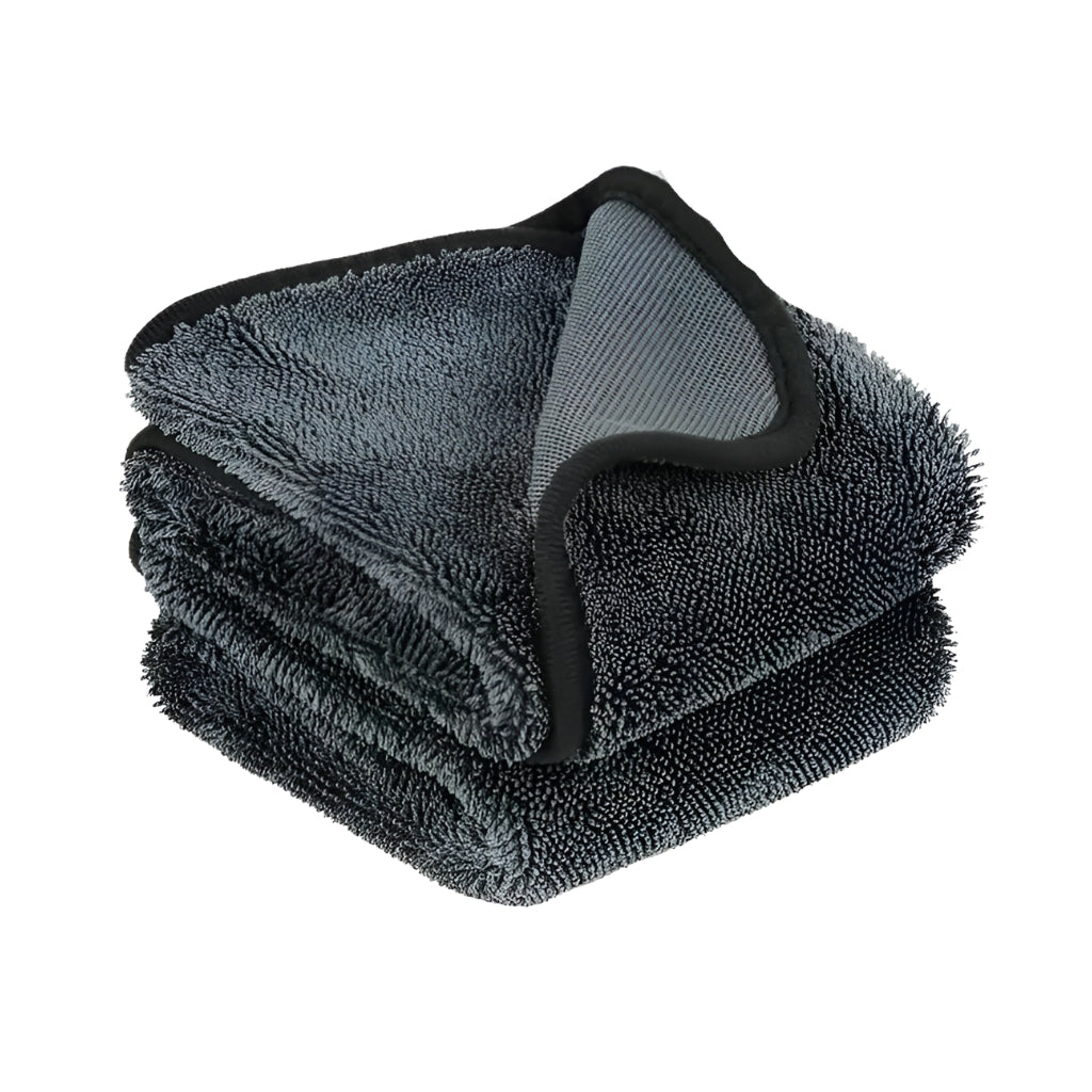 thick microfiber cloth with black edge trim for home and car cleaning.
gray microfiber towels stacked on white background with car cleaning example.