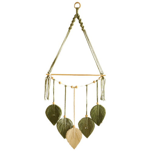 boho wall shelves with macrame leaf design hanging on bedroom wall
wooden floating shelf with green macrame leaves and bead accents