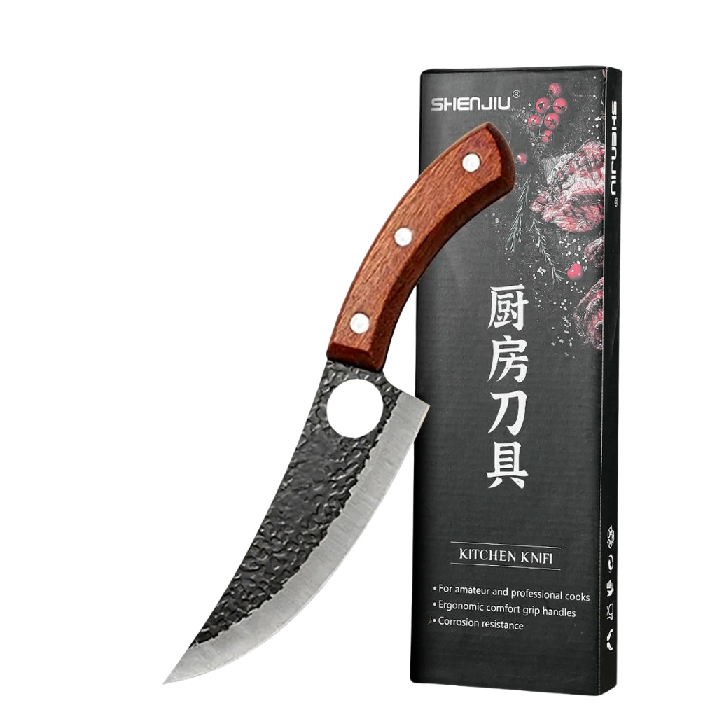 Hand forged kitchen knife with wooden handle on a white kitchen counter